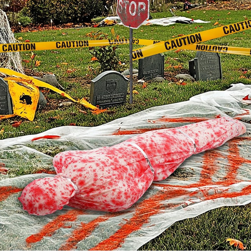 Bloody corpse Halloween prop in a graveyard crime scene display