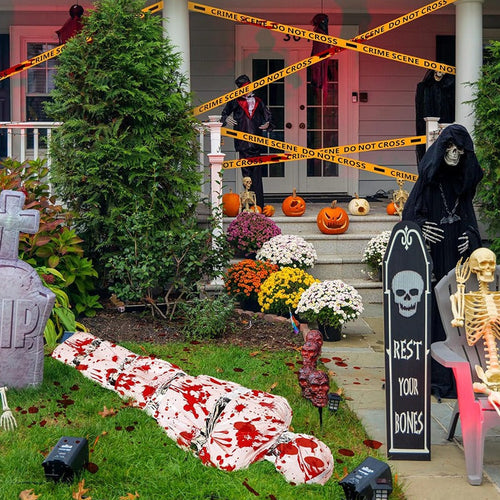 Bloody corpse Halloween decoration in a haunted front yard display