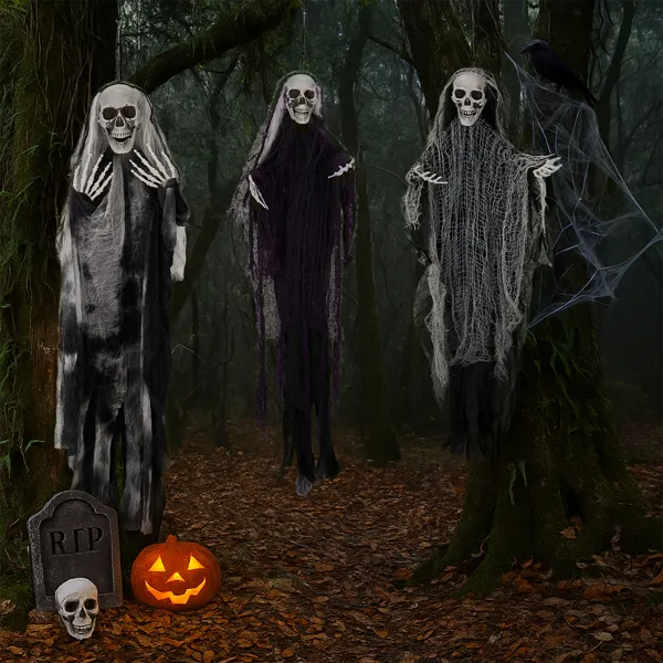 Three hanging Grim Reaper Halloween decorations in a dark haunted forest